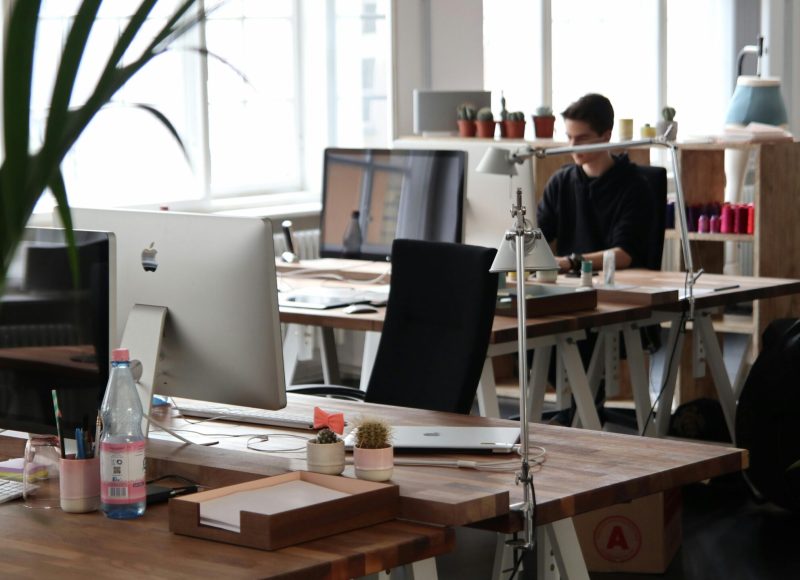 Open-plan office with modern decor and natural lighting, ideal for productivity.